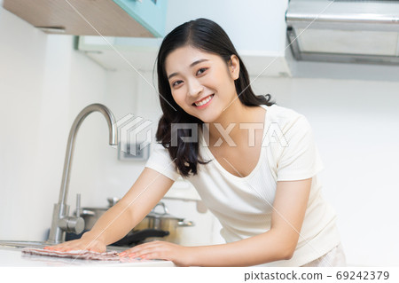 Woman housecleaning Woman housecleaning 69242379