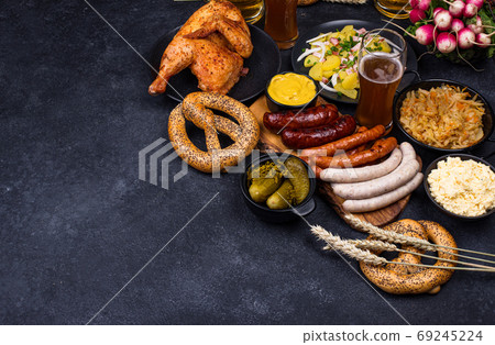 Oktoberfest dishes with beer, pretzel and sausage Oktoberfest dishes with beer, pretzel and sausage 69245224