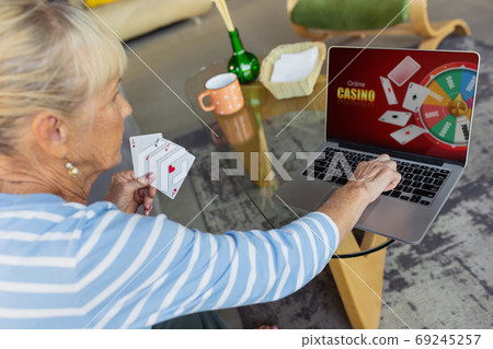 Senior woman studying at home, getting online courses 69245257