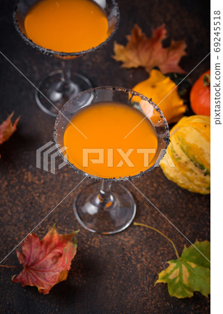 Halloweens drink pumpkin martini cocktail Halloweens drink pumpkin martini cocktail 69245518