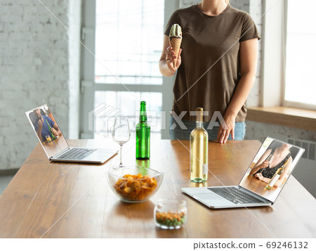 Virtual talking with friends, celebrating and drinking alcohol. All the meetings coming to remote way during coronavirus quarantine 69246132
