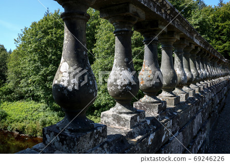 Old Bridge Parapet Over a River Closeup View 69246226