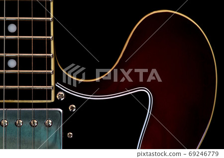 Electric Guitar Closeup View on a Black Background Electric Guitar Closeup View on a Black Background 69246779