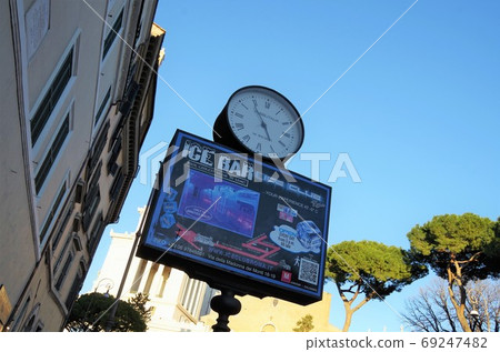 Roman sidewalk with advertising clock Roman sidewalk with advertising clock 69247482
