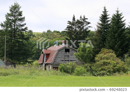 Scenery with an old cowhouse in Kushiro, Hokkaido 69248023