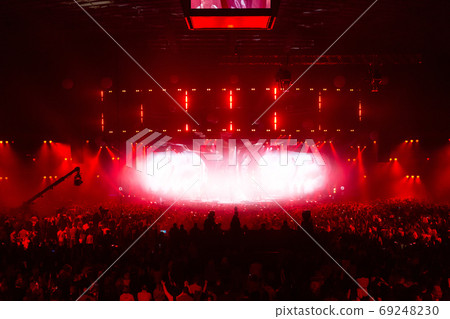 Stage illuminated by beautiful rays of lighting equipment. 69248230