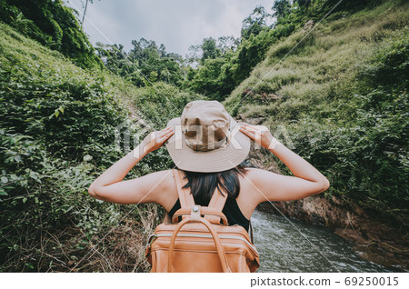 travel woman enjoying nature in mountain when hiking 69250015