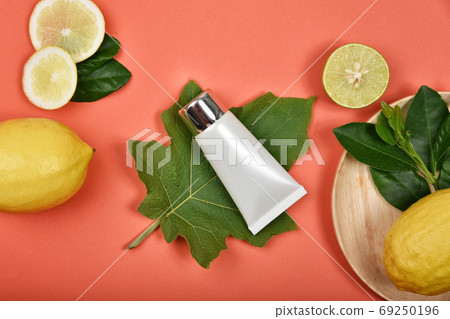 Cosmetic bottle containers with fresh lemon slices, Blank label for branding mock-up 69250196