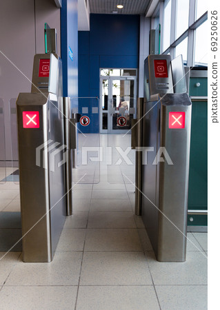 Ticket gate in the Domodedovo airport is closed. Entrance gate access touch technology security system. 69250626