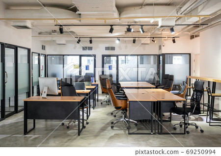 Empty modern office with desk and chair temporarily closed from 69250994