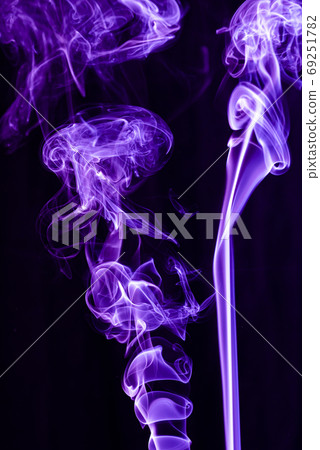Violet abstract shaped smoke against black background. Abstract background Violet abstract shaped smoke against black background. Abstract background 69251782