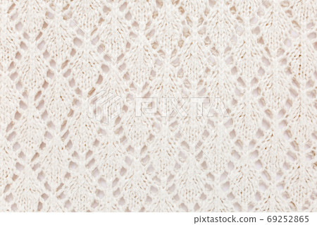 Beige knitted wool texture pattern. High quality Beige knitted wool texture pattern. High quality 69252865