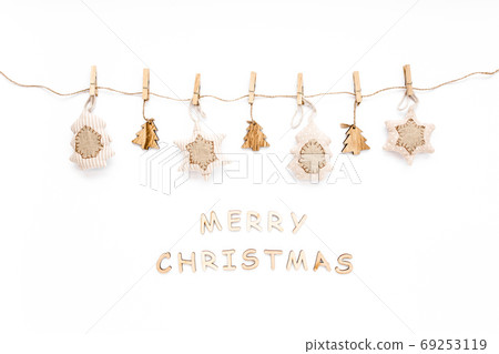 Christmas pattern made and of handmade knitted toys on white background. Merry Christmas. flat lay, top view Christmas pattern made and of handmade knitted toys on white background. Merry Christmas. flat lay, top view 69253119