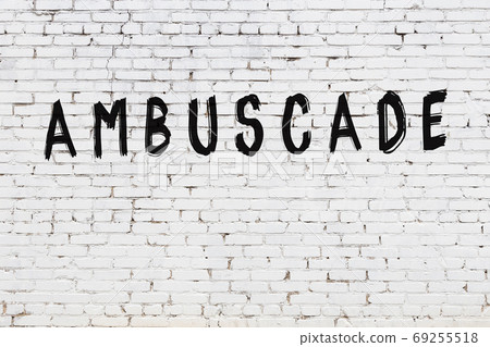 Inscription ambuscade painted on white brick wall 69255518