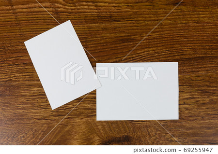 White sheet of papers on wood table White sheet of papers on wood table 69255947