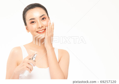 Beauty asian woman hold bottle cosmetic cream lotion  and cheerf 69257120