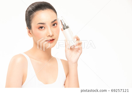 Beauty asian woman hold bottle cosmetic cream lotion and cheerf Beauty asian woman hold bottle cosmetic cream lotion and cheerf 69257121