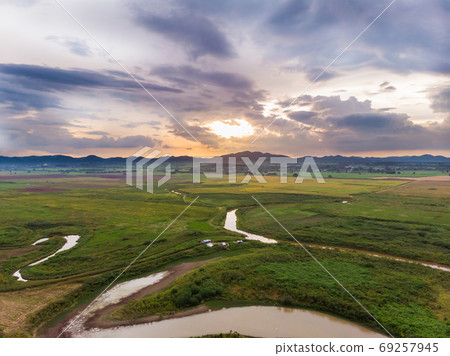 Scenic landscape aerial view of field river and basin against a 69257945