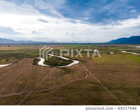 Scenic landscape aerial view of field river and basin against a 69257946
