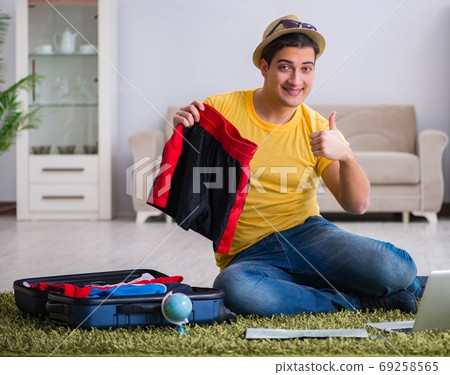 The man planning his vacation trip with map The man planning his vacation trip with map 69258565