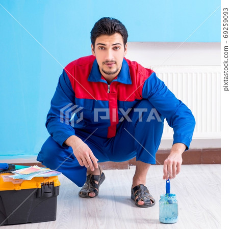Young man doing home renovation Young man doing home renovation 69259093