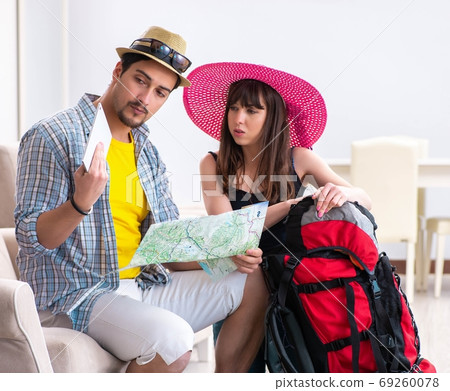 Young pair planning their honeymoon camping trip 69260078