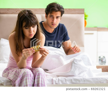 Man using pills for woman satisfaction 69261321