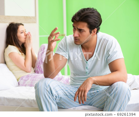 Woman and man in the bedroom after conflict Woman and man in the bedroom after conflict 69261394