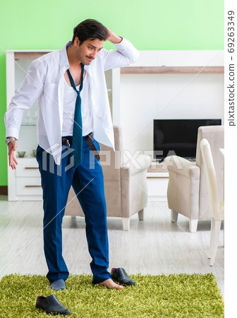 Man dressing up and late for work Man dressing up and late for work 69263349