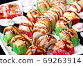 set of different types of sushi on a white plate 69263914
