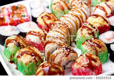 set of different types of sushi on a white plate 69263914