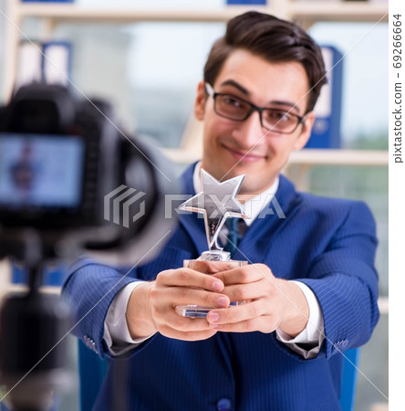 Businessman recording a video for vlog 69266664