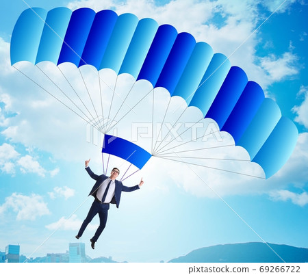 Young businessman falling on parachute in business concept Young businessman falling on parachute in business concept 69266722