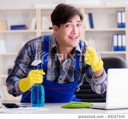The male cleaner working in the office The male cleaner working in the office 69267345