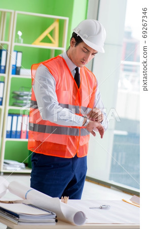 Man architect working on the project Man architect working on the project 69267346