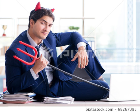 Devil angry businessman in the office Devil angry businessman in the office 69267383