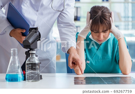 Doctor angry at his assistant due to medical error 69267759