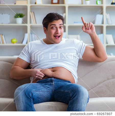 Fat obese man in dieting concept 69267807