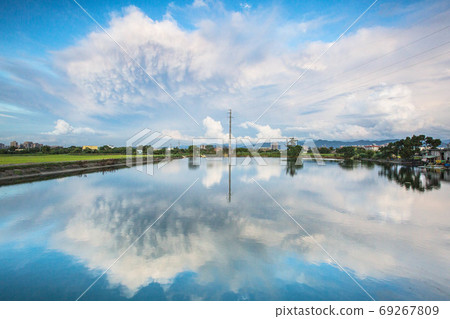 Fish pond reflection 69267809