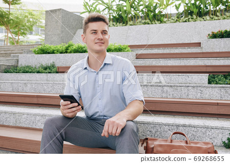 Handsome excited businessman Handsome excited businessman 69268655