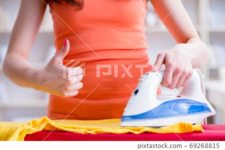 Woman wife doing ironing at home 69268815