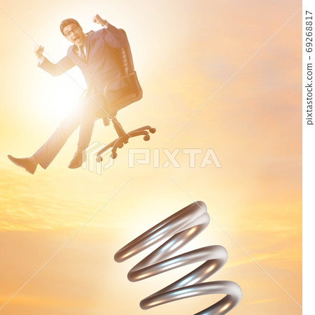 Businessman jumping from spring in promotion concept 69268817