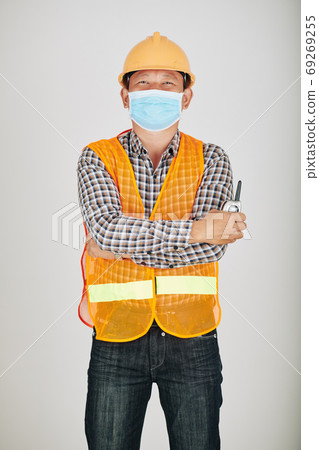 Contractor in safety vest and medical mask Contractor in safety vest and medical mask 69269255