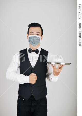 Waiter serving coffee Waiter serving coffee 69269263