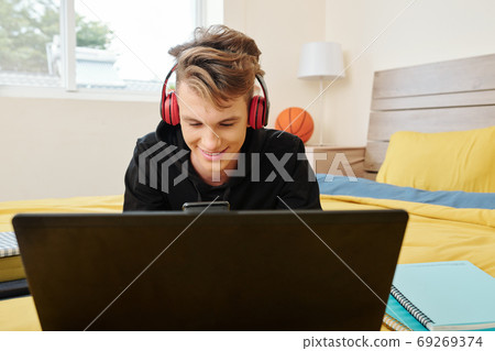 Texting teenage boy Texting teenage boy 69269374