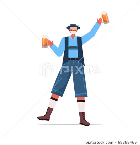 man in medical mask holding beer mugs Oktoberfest party celebration coronavirus quarantine concept man in medical mask holding beer mugs Oktoberfest party celebration coronavirus quarantine concept 69269469