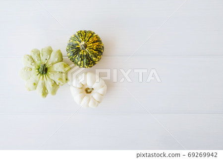 Colorful mini pumpkins of different colors on white background. Colorful mini pumpkins of different colors on white background. 69269942