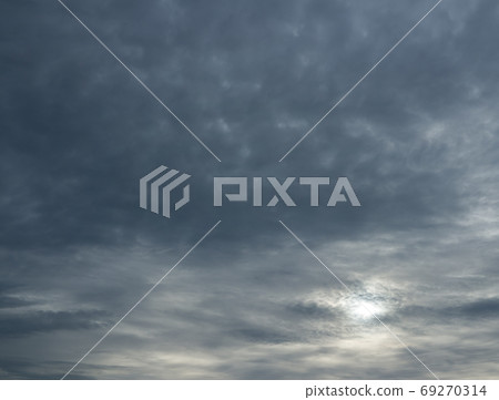 Sun shine through stormy clouds. 69270314