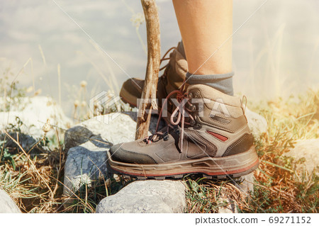 Close up of women legs wearing hiking boots in mountain 69271152