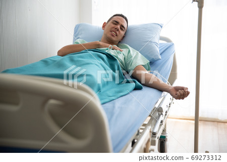 Young Man Lying On Bed At Hospital 69273312